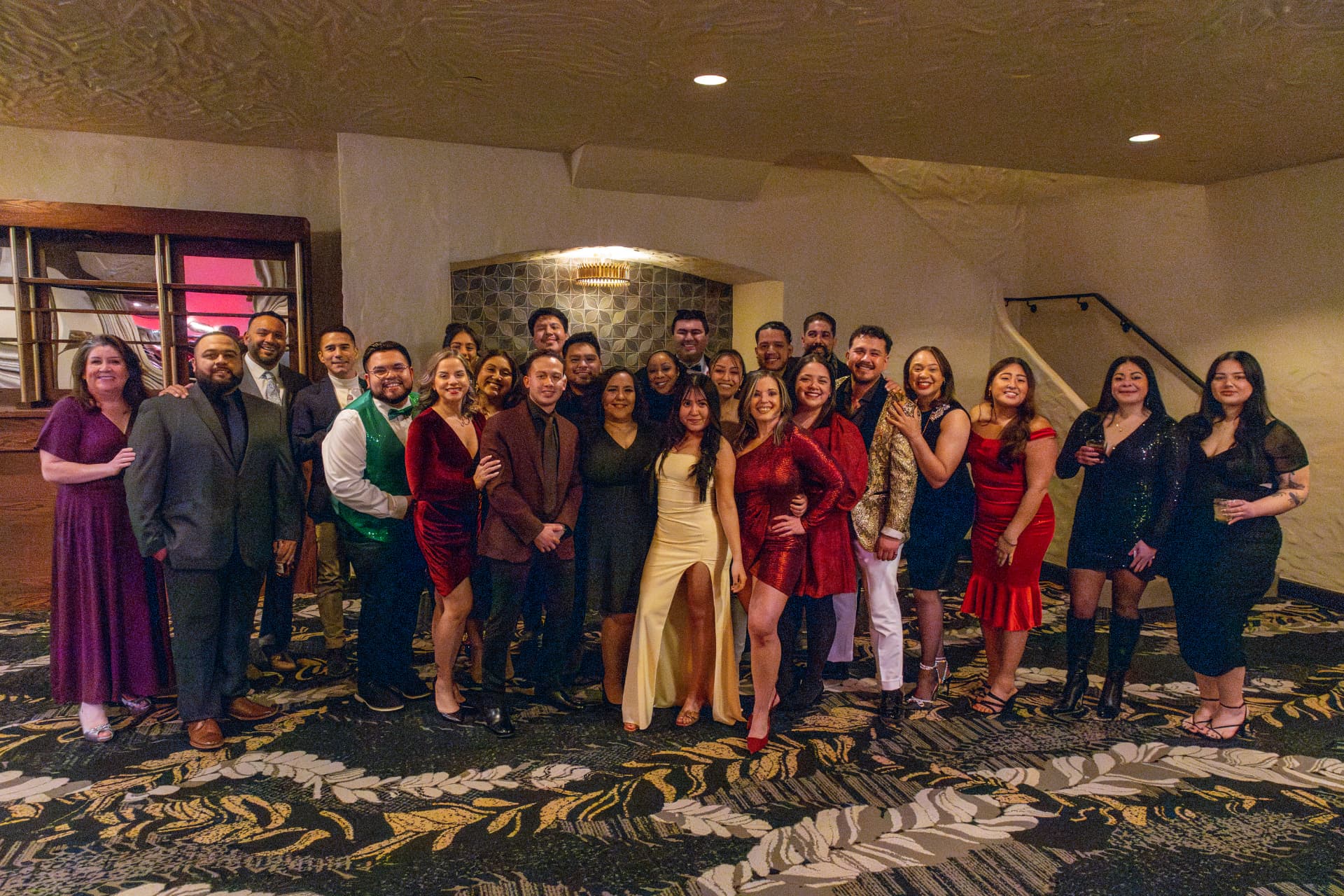 NCW colleagues posing together at the 2026 holiday party